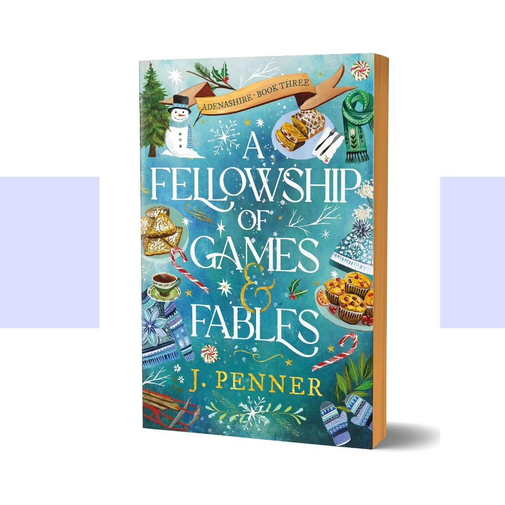 The Deluxe Edition cover of A Fellowship of Games & Fables by J. Penner features a richly illustrated winter scene framed by a bright turquoise and teal background. The festive artwork is filled with cozy seasonal details and magical winter imagery. A cheerful snowman wearing a dark top hat stands near the upper left, surrounded by evergreen trees and falling snow. Snowflakes, delicate winter branches, and decorative foliage and sweet treats are scattered throughout the design.