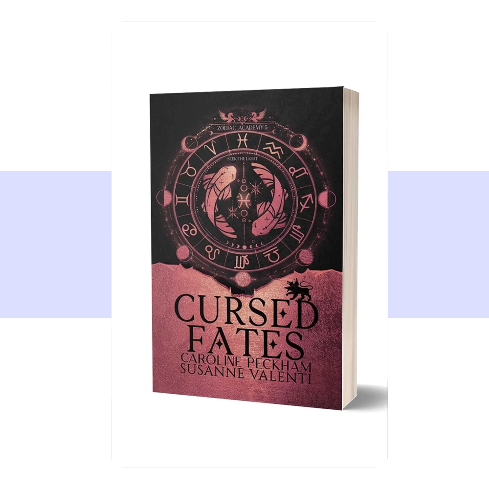 The cover of Zodiac Academy 5: Cursed Fates features a dark, atmospheric fantasy design with a black and deep midnight-blue background, highlighted by ornate metallic gold details. An intricate circular zodiac emblem and astrological symbols dominate the design, suggesting celestial forces, magical destiny, and the power struggles at the heart of the story. The title "CURSED FATES" appears in large, decorative gold lettering, with "ZODIAC ACADEMY 5" integrated into the composition. 