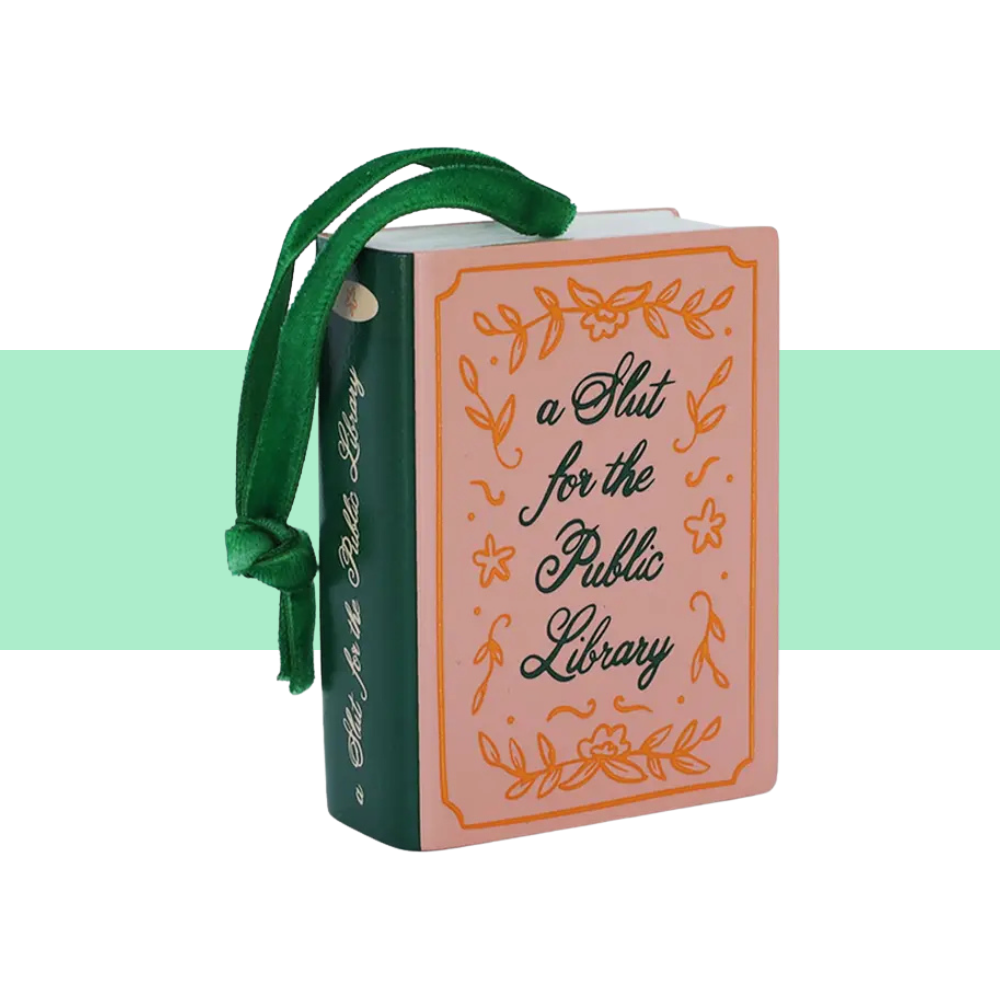 green and brown holiday ornament "a slut for the public library" with green ribbon