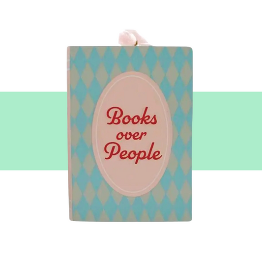 green and blue and pink ornament resin bookcover books over people 