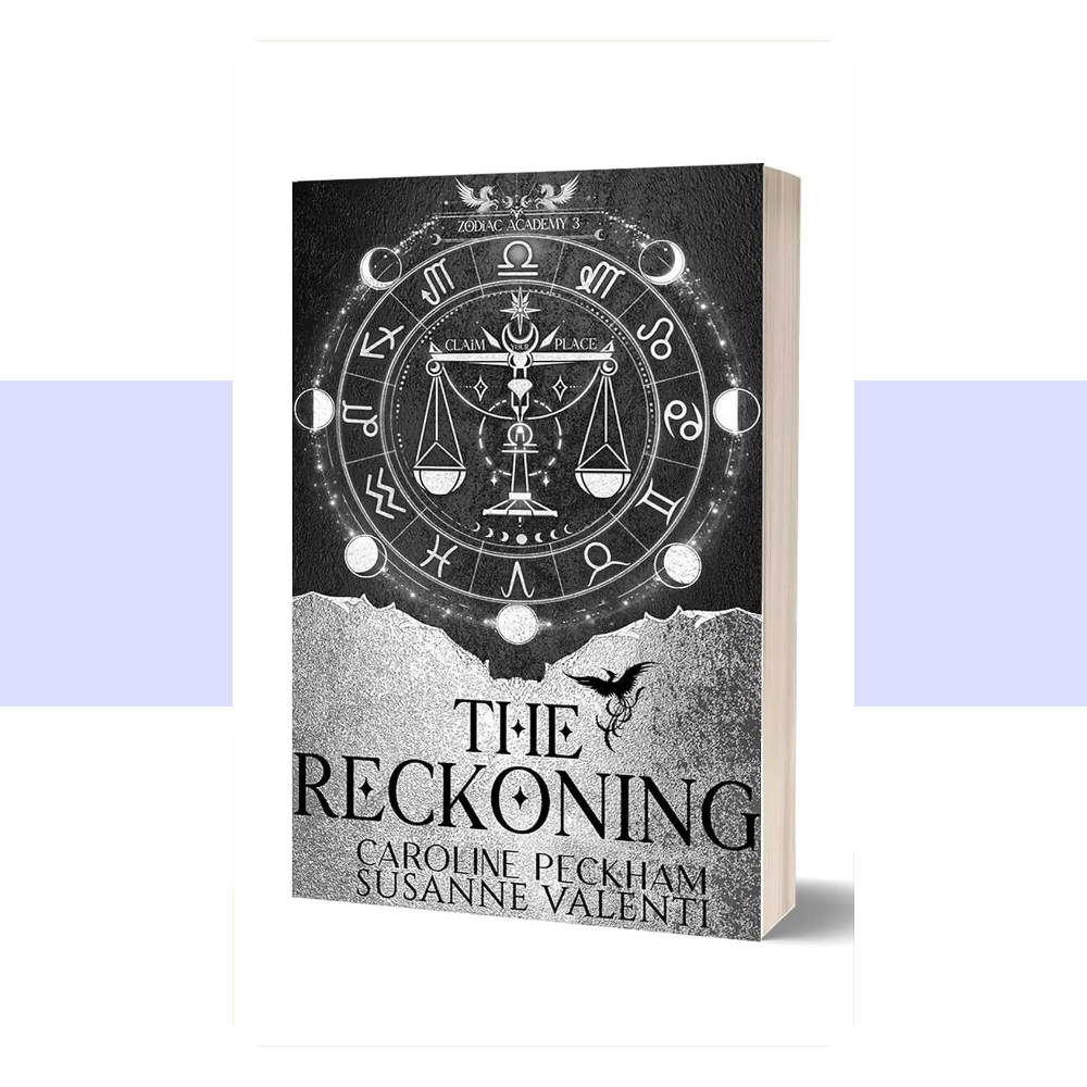 Book cover for Zodiac Academy 3: The Reckoning by Caroline Peckham and Susanne Valenti. The cover features a dark, atmospheric fantasy design dominated by deep navy blue, black, and rich metallic gold tones. The title “ZODIAC ACADEMY” appears prominently near the top in large gold serif lettering, with “THE RECKONING” displayed beneath it in bold gold capital letters. A detailed circular zodiac emblem with astrological symbols and a glowing central design occupies much of the lower portion of the cover.