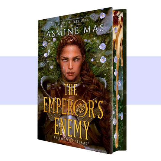 The Emperor's Enemy paperback book by Jasmine Mas, shown at a three-quarter angle to display both the front cover and the spine. The cover features a fantasy illustration of a woman with brown hair in armor against a background of green foliage and white flowers, with the title in large gold lettering.
